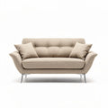 Beige fabric loveseat with sleek metal legs and two accent pillows